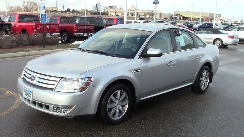 A silver 2009 Ford Taurus parked