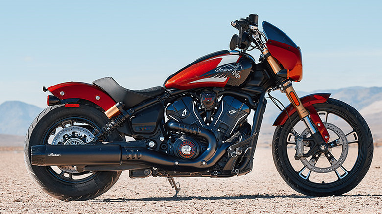 A red 2025 Indian Scout 101 model parked in desert