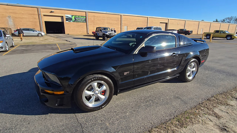 A black 2007 Ford Mustang parked