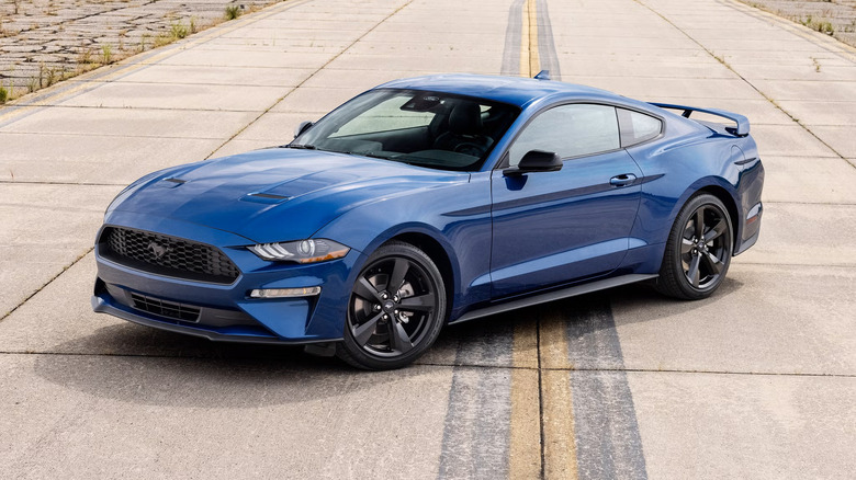 A blue 2022 Ford Mustang parked sideways