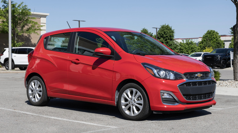 A red 2021 Chevrolet Spark parked