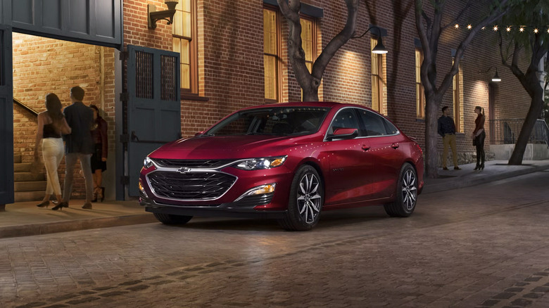A red 2022 Chevrolet Malibu parked