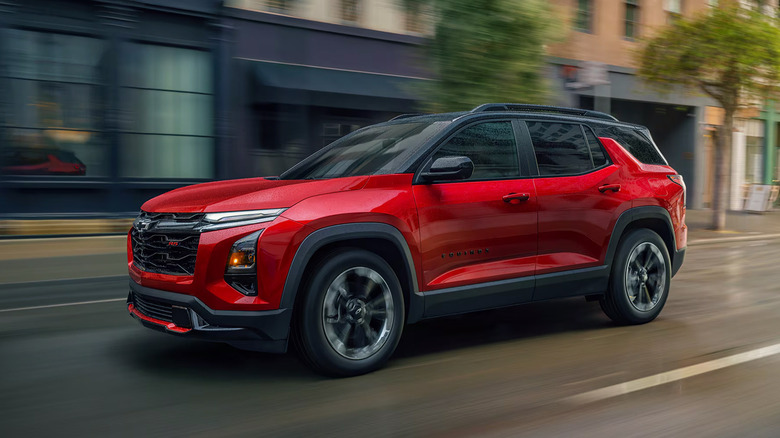 A red 2025 Chevrolet Equinox driving