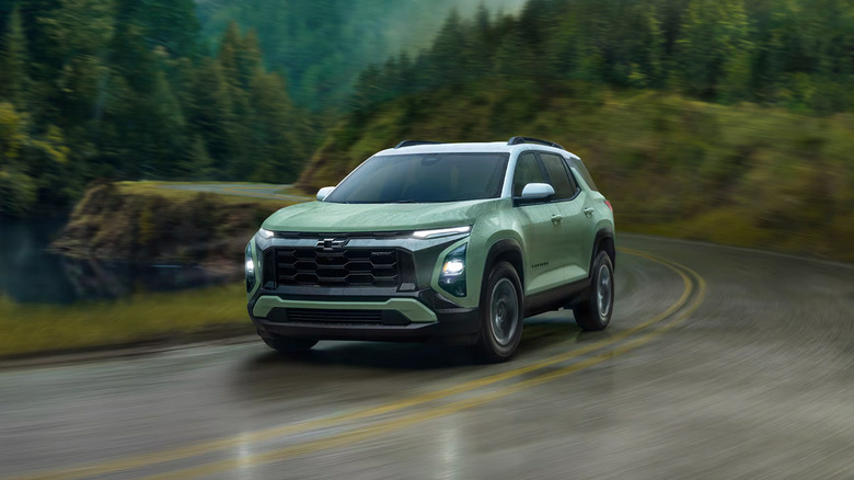 A green 2025 Chevrolet Equinox driving