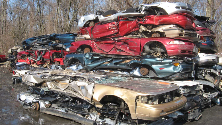 Piles of junked cars at a scrapyard