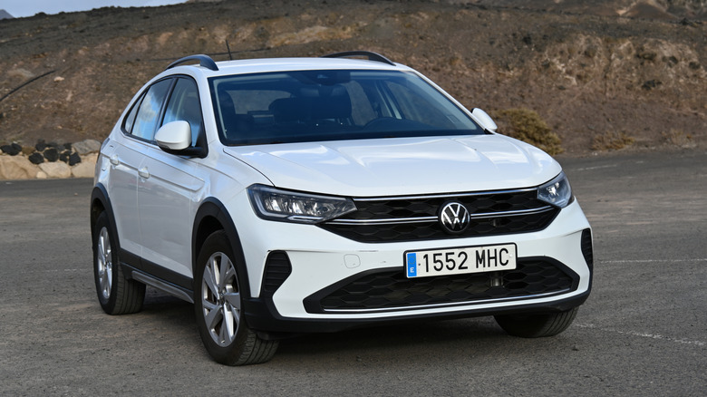 A white 2023 Volkswagen Taigo in a parking lot, front view visible