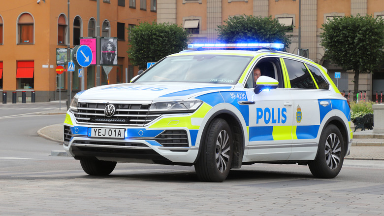 A white Volkswagen Touareg seen here in a test version in a parking lot.