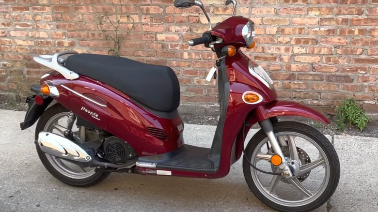 Kymco People 150 on sidewalk