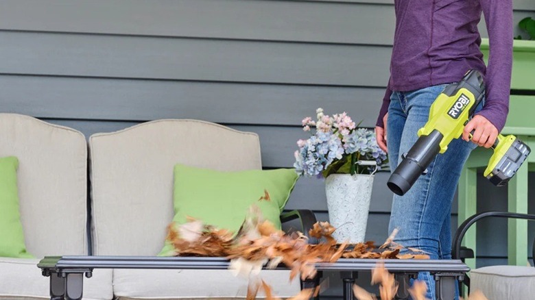 Person using Ryobi 220 CFM Blower