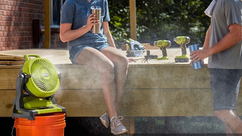 Ryobi misting fan with people in the background