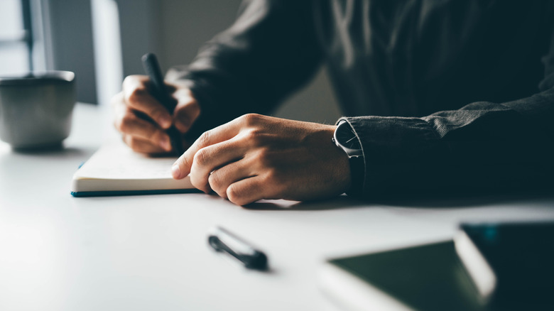 Man compiling a list