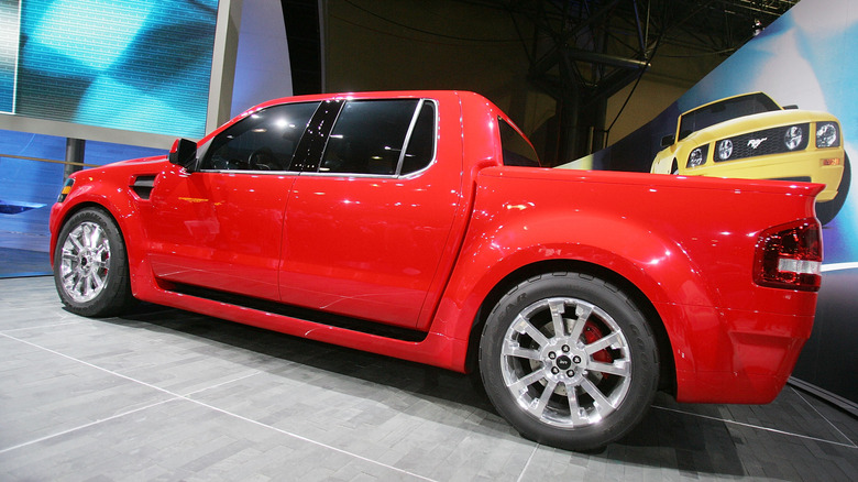 A 2007 red ford explorer trac sport adrenalin displayed indoors on a podium
