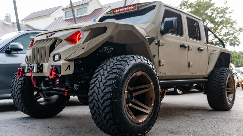 A jeep gladiator spartan edition parked outside at the edge of a road