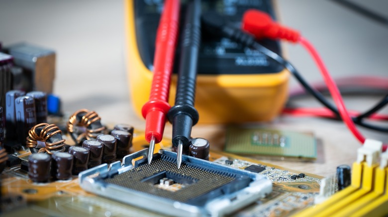 testing computer part with a multimeter