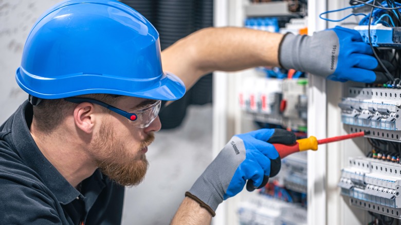 electrician working with protective equipment