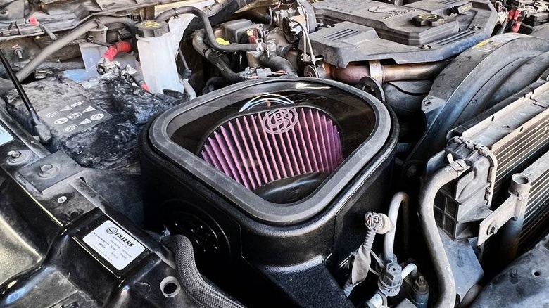 A Cummins diesel engine with an aftermarket S&B cold air intake.