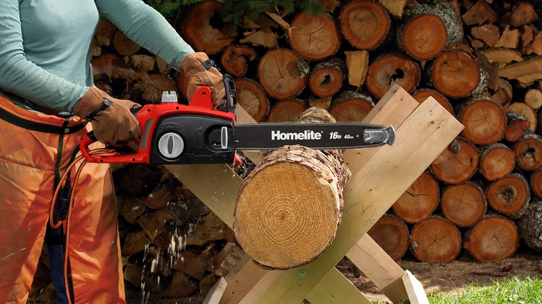 cutting log with Homelite chainsaw