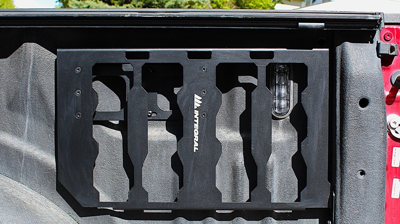 Integral bed side cargo panel