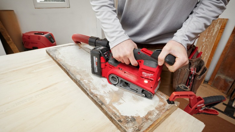 sanding with Milwaukee belt sander