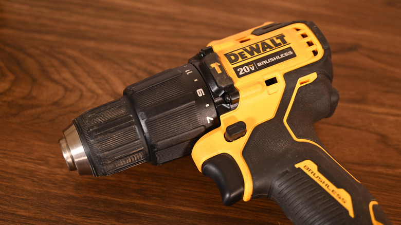A DeWalt 20V drill on a table.