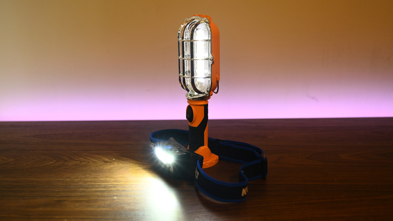 Two lights on a table in the dark.