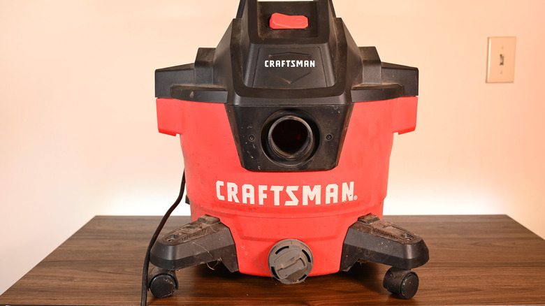 A Craftsman Shop Vac on a desk with backlighting.