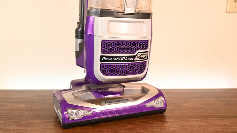 A Shark Navigator vacuum on a desk