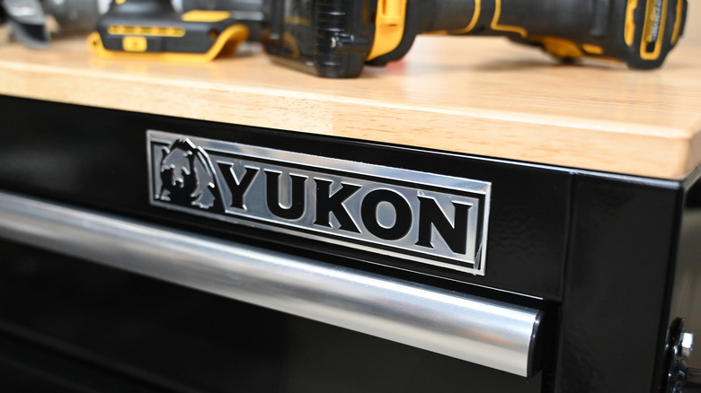A Yukon workbench and toolbox with tools on top.