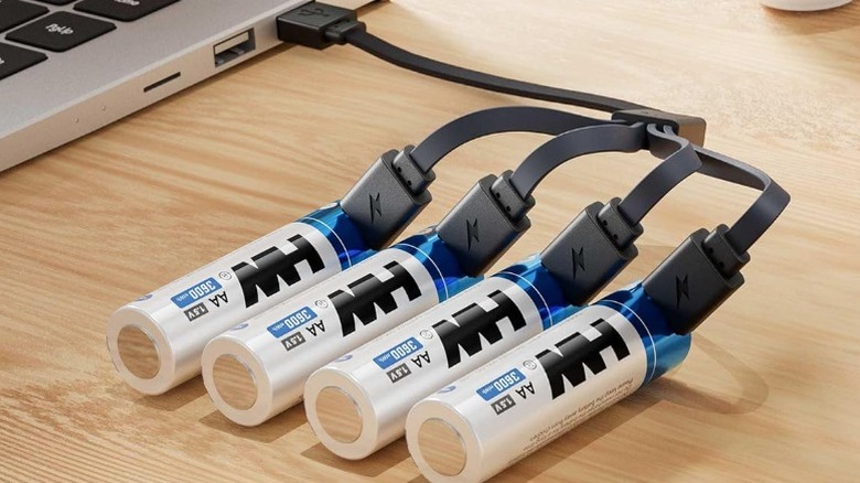 Four HW AA batteries charging from a laptop's USB port