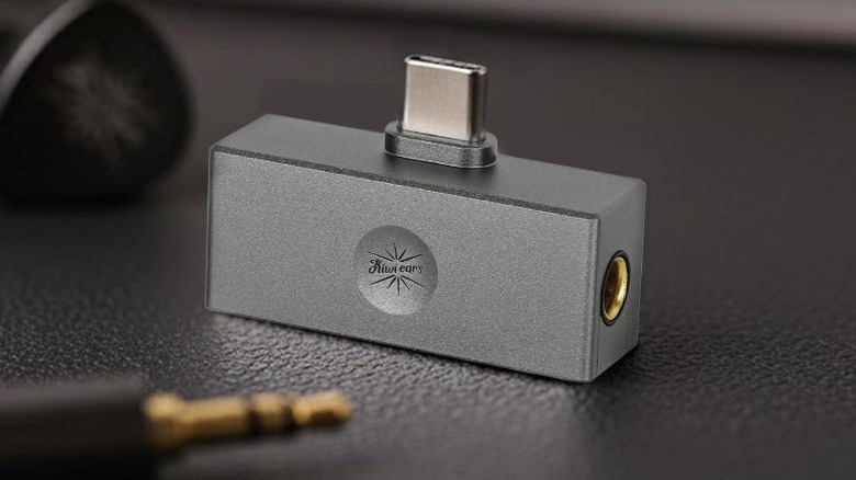 Kiwi Ears Allegro Mini dongle with an out-of-focus 3.5mm jack in the foreground