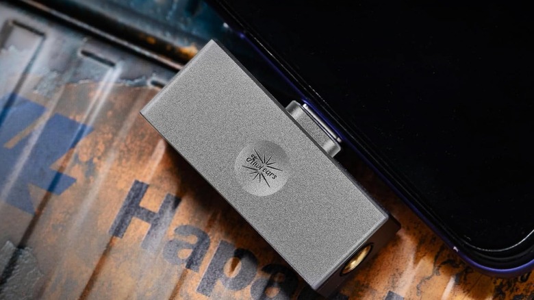 Close up of Kiwi Ears Allegro Mini dongle connected to smartphone