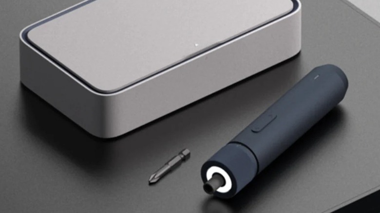 Hoto electric screwdriver on a table next to case and loose bit