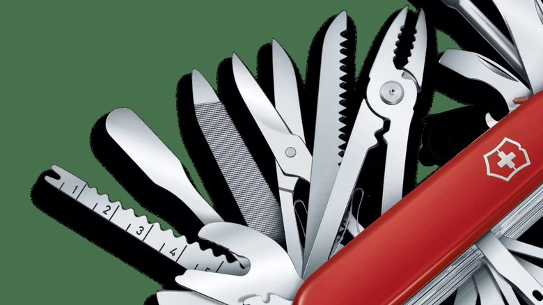 A close-up of the SwissChamp XXL with multiple tools extended, including a rounded pharmaceutical spatula.
