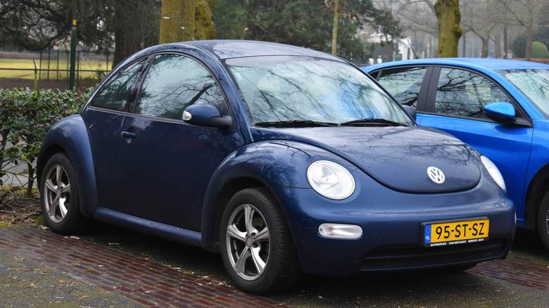 Blue 2006 Volkswagen Beetle parked.