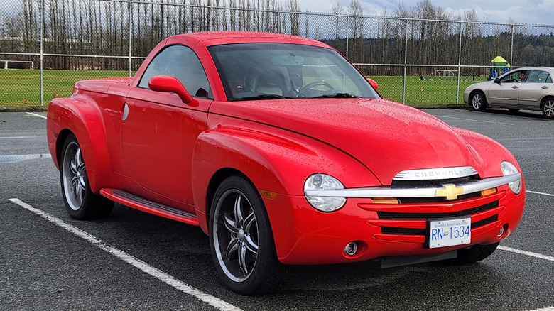 Bright red Chevrolet SSR in parking lot.