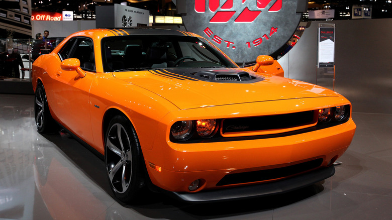 Orange 2014 Dodge Challenger at auto show.