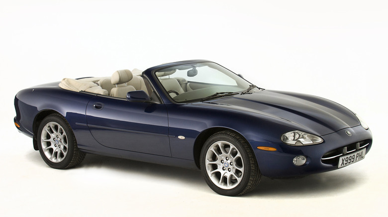 2001 Jaguar XK8 on a white background showroom.