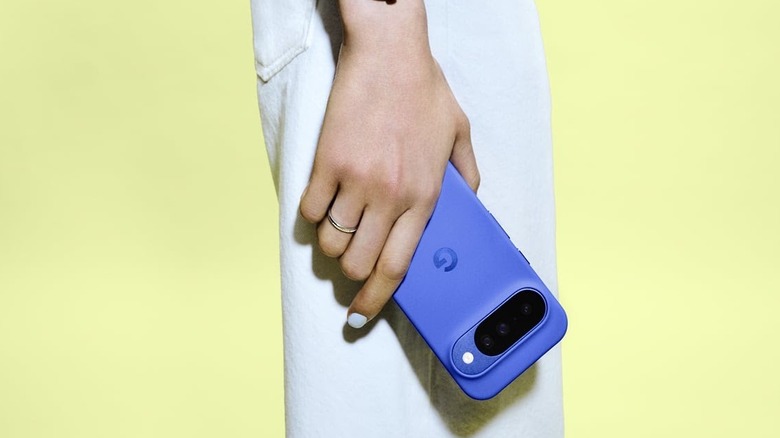 A person holding the Google Pixel 10