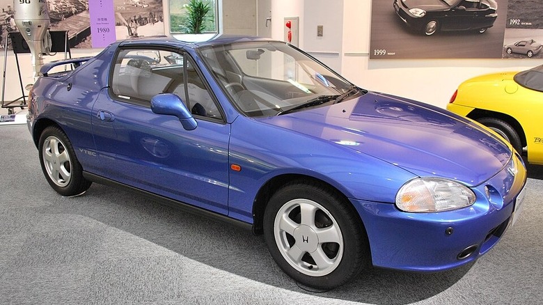blue three quarter view honda del sol in showroom