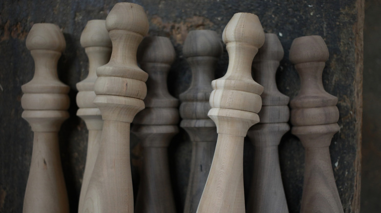 Severa identical table legs on a dark background