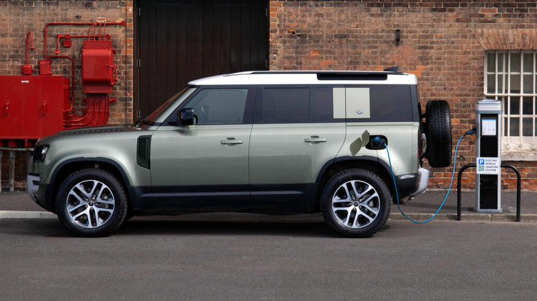 Plug-in hybrid Land Rover Defender with an EV charger