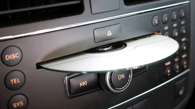 Close up of a car CD player with a CD partially inside