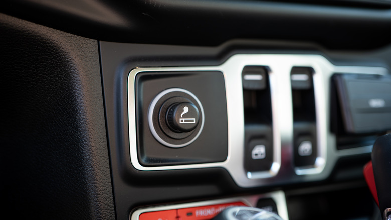 Close up of an old car cigarette lighter in a dashboard