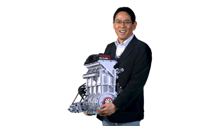 NISMO President Shoichi Miyatani holding the Zeod RC's engine