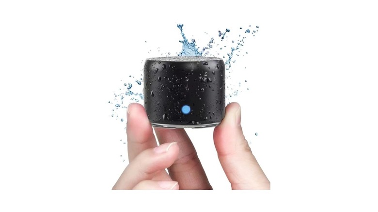 EWA portable Bluetooth speaker with water splashing on it