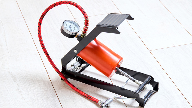 Tire pressure gauge on display in orange