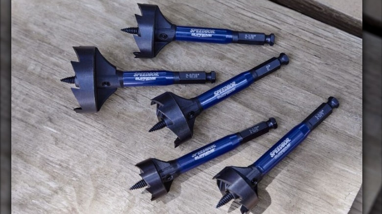 Five augers with blue handles