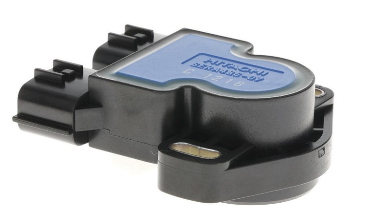 A black and blue Hitachi Throttle Position Sensor against a white background.