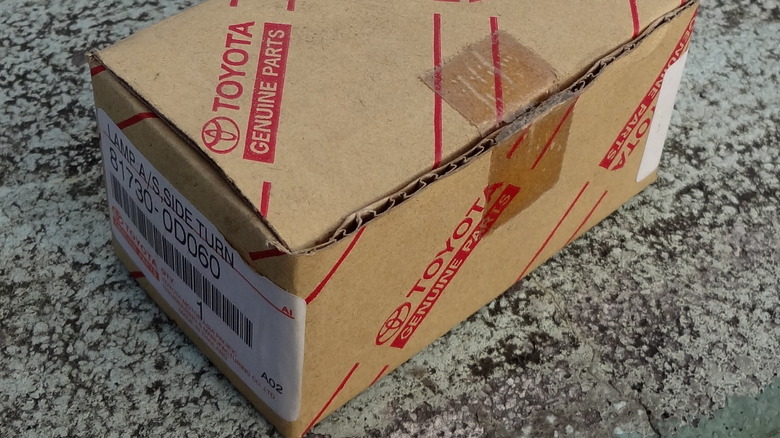 A Genuine Toyota Parts box sitting on a granite countertop.