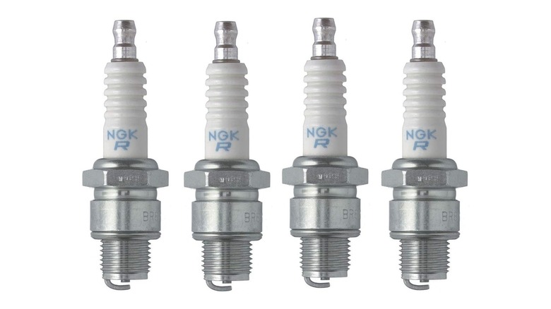 Four NGK spark plugs